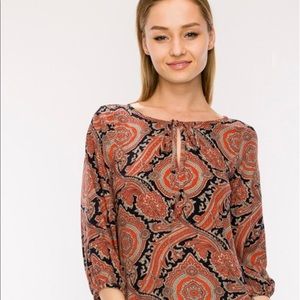 Damask print top in orange and navy/black